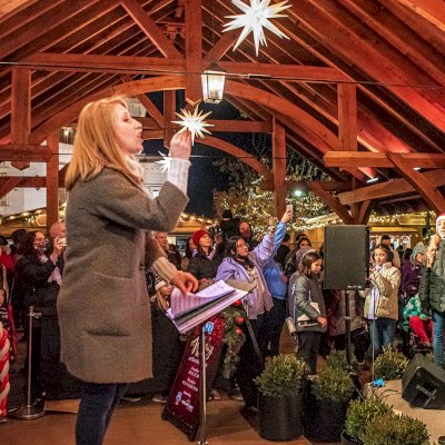 Cardinal's Nest Pavilion (Options: 80' L x 34' W, California Redwood, Transparent Premium Sealant). Pavilion Installed in Carmel, IN, for the Carmel Christkindlmarkt, Named Best Holiday Market in the Country in 2021.