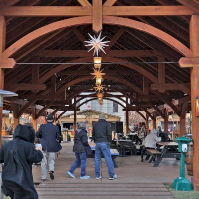 Cardinal's Nest Pavilion (Options: 80' L x 34' W, California Redwood, Transparent Premium Sealant). Pavilion Installed in Carmel, IN, for the Carmel Christkindlmarkt, Named Best Holiday Market in the Country in 2021.