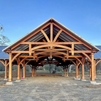 Custom Cardinal's Nest Pavilion (Options: 74' x 74', Douglas-fir, 20-Post Anchor Kit for High-Wind, 10' H Posts, Horizontal Decorative Trims for All Posts, with 5 Ceiling Fan Bases, Transparent Premium Sealant, White Wash for Ceiling). Photo Courtesy of J. Fookes of Elk Creek, CA.