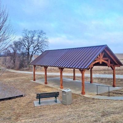 Custom Cardinal's Nest Pavilions (Options: 40’ L x 20’ W, Mosaic Redwood, 8-Post Anchor Kit for High-Wind, Electrical Wiring Trim Kit for 4 Posts, No Ceiling Fan Bases, Transparent Premium Sealant). Photo Courtesy of White Cloud Health Center of White Cloud, Kansas.