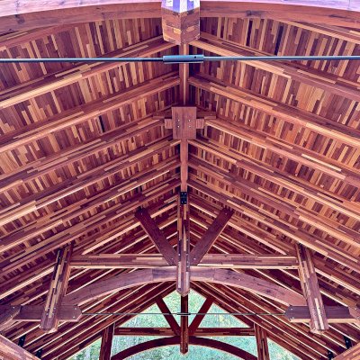 Cardinal's Nest Pavilion (Options: 26' L x 22' W, Mosaic Redwood, 2 Ceiling Fan Bases, 10' H Posts, with Vertical Post Decorative Trims, 2 Shutter Privacy Panels Half Height without Wall, with Fascia Boards, Post Anchor Kit for High-Wind, Transparent Premium Sealant). Photo Courtesy of K. Kolcuski of Petoskey, MI.