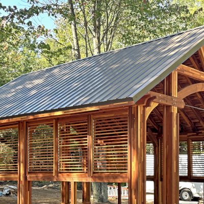 Cardinal's Nest Pavilion (Options: 26' L x 22' W, Mosaic Redwood, 2 Ceiling Fan Bases, 10' H Posts, with Vertical Post Decorative Trims, 2 Shutter Privacy Panels Half Height without Wall, with Fascia Boards, Post Anchor Kit for High-Wind, Transparent Premium Sealant). Photo Courtesy of K. Kolcuski of Petoskey, MI.