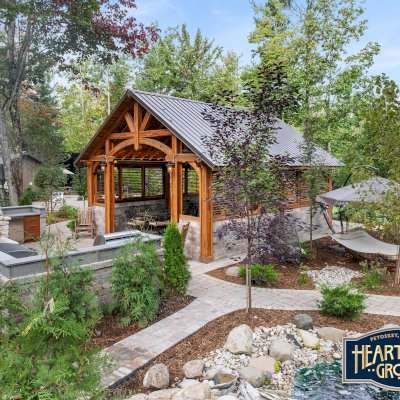 Cardinal's Nest Pavilions (Options: 26’ L x 22’ W, Mosaic Redwood, Post Anchor Kit for High-Wind, 2 Shutter Privacy Panels Half Height Without Wall, Vertical Post Decorative Trims, 10' H Posts, 2 Ceiling Fan Bases, Transparent Premium Sealant). Photo Courtesy of at Hearthside Grove Motorcoach Resort, 4978 Monarch way, Petoskey, MI 49770. 
