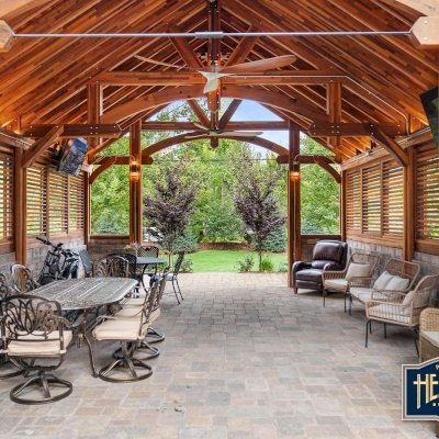 Cardinal's Nest Pavilions (Options: 26’ L x 22’ W, Mosaic Redwood, Post Anchor Kit for High-Wind, 2 Shutter Privacy Panels Half Height Without Wall, Vertical Post Decorative Trims, 10' H Posts, 2 Ceiling Fan Bases, Transparent Premium Sealant). Photo Courtesy of at Hearthside Grove Motorcoach Resort, 4978 Monarch way, Petoskey, MI 49770. 