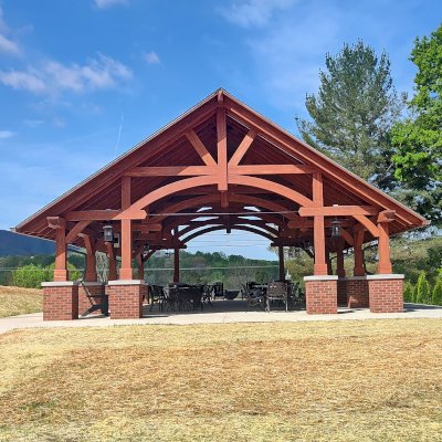 Cardinal's Nest Pavilion (Options: 55' L x 34' W, Mosaic Douglas-Fir, Parquet Roof, with 4 Ceiling Fan Bases, 10x10 Posts, 7' H Posts, Coffee-Stain Premium Sealant). Project is located on the campus of Milligan University, 1 Blowers Blvd. Milligan, TN.