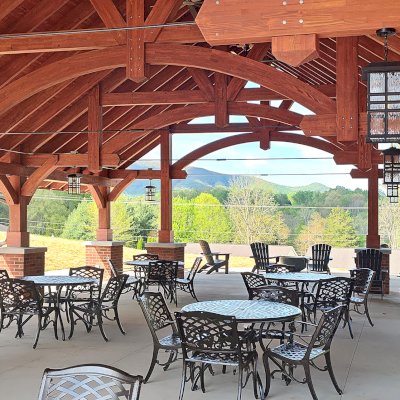 Cardinal's Nest Pavilion (Options: 55' L x 34' W, Mosaic Douglas-Fir, Parquet Roof, with 4 Ceiling Fan Bases, 10x10 Posts, 7' H Posts, Coffee-Stain Premium Sealant). Project is located on the campus of Milligan University, 1 Blowers Blvd. Milligan, TN.