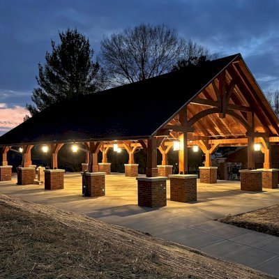 Cardinal's Nest Pavilion (Options: 55' L x 34' W, Mosaic Douglas-Fir, Parquet Roof, with 4 Ceiling Fan Bases, 10x10 Posts, 7' H Posts, Coffee-Stain Premium Sealant). Project is located on the campus of Milligan University, 1 Blowers Blvd. Milligan, TN.