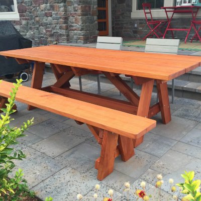 Classic Redwood Patio Table (Options: 8' L, 34 ½" W, Side Bench, Mature Redwood, 1 Full Length Side Bench on One Side, Custom Tabletop [3-Plank Bookmatch Top], Slightly Rounded Corners, No Umbrella Hole, Transparent Premium Sealant). Photo Courtesy of J. Gannon of Broomfield, CO.