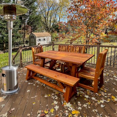 Classic Redwood Patio Table (Options: 6' L x 34 1/2" W, California Redwood, Benches & Ruth Armless Chairs, 1 Full Length Bench and 4 Chairs by Custom Request, Standard Tabletop, Slightly Rounded Corners, No Umbrella Hole, Transparent Premium Sealant). Photo Courtesy of C. Borrell of Rockville, Maryland.