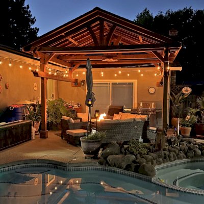 Custom Del Norte Porch Pavilion (Options: 14' L x 16' W, California Redwood, 2-Post Anchor Kit for Concrete, 10.5' H Posts, 1 Ceiling Fan Base, No Electrical Wiring Trim Kit, No Post Decorative Trims, Transparent Premium Sealant). Photo Taken 2 Years After Installation. Photo Courtesy of R. Dakin of Vacaville, CA.
