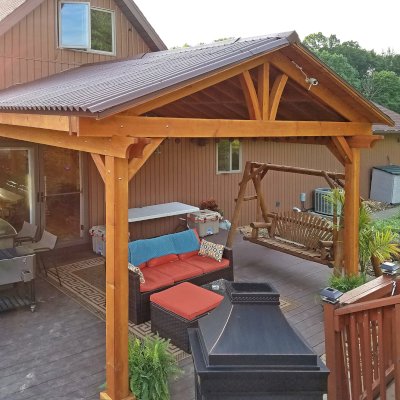 Del Norte Porch Pavilion (Options: 15'L x 15'W, Douglas-fir, 2-Post Anchor Kit for Wood, 2 Electrical Wiring Trims, 8.5 ft Posts Height, 1 Ceiling Fan Base, No Curtain Rods, No Privacy Panels, Transparent Premium Sealant). Photo Courtesy of M. McGinnis of Sarver, Pennsylvania.