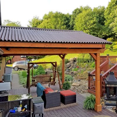 Del Norte Porch Pavilion (Options: 15'L x 15'W, Douglas-fir, 2-Post Anchor Kit for Wood, 2 Electrical Wiring Trims, 8.5 ft Posts Height, 1 Ceiling Fan Base, No Curtain Rods, No Privacy Panels, Transparent Premium Sealant). Photo Courtesy of M. McGinnis of Sarver, Pennsylvania.