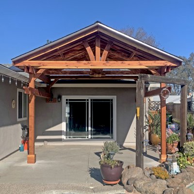 Custom Del Norte Porch Pavilion (Options: 14' L x 16' W, California Redwood, 2-Post Anchor Kit for Concrete, 10.5' H Posts, 1 Ceiling Fan Base, No Electrical Wiring Trim Kit, No Post Decorative Trims, Transparent Premium Sealant). Photo Courtesy of R. Dakin of Vacaville, CA.