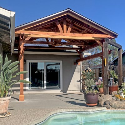 Custom Del Norte Porch Pavilion (Options: 14' L x 16' W, California Redwood, 2-Post Anchor Kit for Concrete, 10.5' H Posts, 1 Ceiling Fan Base, No Electrical Wiring Trim Kit, No Post Decorative Trims, Transparent Premium Sealant). Photo Courtesy of R. Dakin of Vacaville, CA.