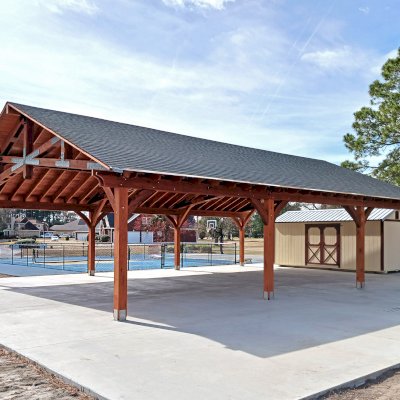 Esther Scissor Truss Pavilion (Options: 45’ L x 35’ W, California Redwood, Standard 3/4" T&G Roof Boards, 10' H Posts, with 3 Ceiling Fan Bases, 8 High-Wind Post Anchors, Transparent Premium Sealant). Photo Courtesy of F. Parini of Myrtle Beach, South Carolina.