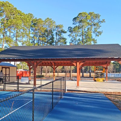Esther Scissor Truss Pavilion (Options: 45’ L x 35’ W, California Redwood, Standard 3/4" T&G Roof Boards, 10' H Posts, with 3 Ceiling Fan Bases, 8 High-Wind Post Anchors, Transparent Premium Sealant). Photo Courtesy of F. Parini of Myrtle Beach, South Carolina.