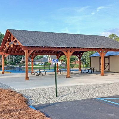 Esther Scissor Truss Pavilion (Options: 45’ L x 35’ W, California Redwood, Standard 3/4" T&G Roof Boards, 10' H Posts, with 3 Ceiling Fan Bases, 8 High-Wind Post Anchors, Transparent Premium Sealant). Photo Courtesy of F. Parini of Myrtle Beach, South Carolina.