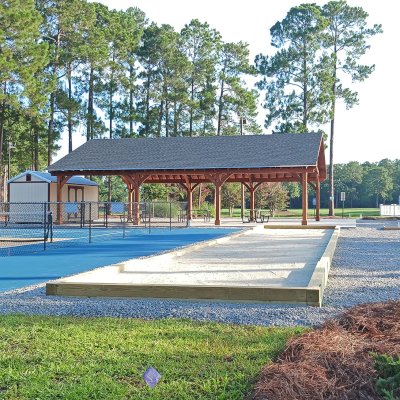 Esther Scissor Truss Pavilion (Options: 45’ L x 35’ W, California Redwood, Standard 3/4" T&G Roof Boards, 10' H Posts, with 3 Ceiling Fan Bases, 8 High-Wind Post Anchors, Transparent Premium Sealant). Photo Courtesy of F. Parini of Myrtle Beach, South Carolina.