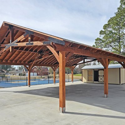 Esther Scissor Truss Pavilion (Options: 45’ L x 35’ W, California Redwood, Standard 3/4" T&G Roof Boards, 10' H Posts, with 3 Ceiling Fan Bases, 8 High-Wind Post Anchors, Transparent Premium Sealant). Photo Courtesy of F. Parini of Myrtle Beach, South Carolina.