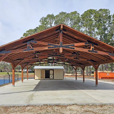 Esther Scissor Truss Pavilion (Options: 45’ L x 35’ W, California Redwood, Standard 3/4" T&G Roof Boards, 10' H Posts, with 3 Ceiling Fan Bases, 8 High-Wind Post Anchors, Transparent Premium Sealant). Photo Courtesy of F. Parini of Myrtle Beach, South Carolina.