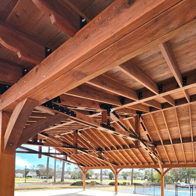 Esther Scissor Truss Pavilion (Options: 45’ L x 35’ W, California Redwood, Standard 3/4" T&G Roof Boards, 10' H Posts, with 3 Ceiling Fan Bases, 8 High-Wind Post Anchors, Transparent Premium Sealant). Photo Courtesy of F. Parini of Myrtle Beach, South Carolina.