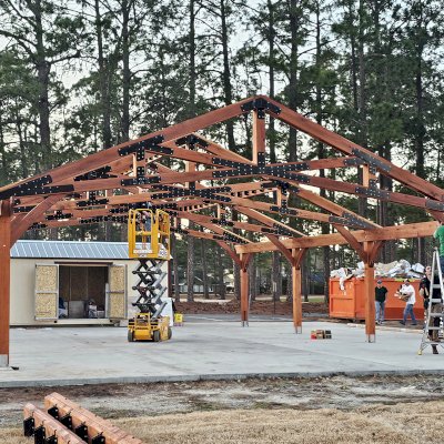 Esther Scissor Truss Pavilion (Options: 45’ L x 35’ W, California Redwood, Standard 3/4" T&G Roof Boards, 10' H Posts, with 3 Ceiling Fan Bases, 8 High-Wind Post Anchors, Transparent Premium Sealant). Photo Courtesy of F. Parini of Myrtle Beach, South Carolina.