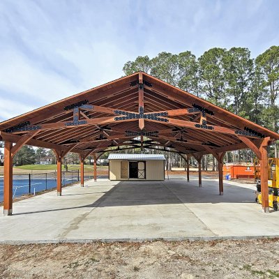 Esther Scissor Truss Pavilion (Options: 45’ L x 35’ W, California Redwood, Standard 3/4" T&G Roof Boards, 10' H Posts, with 3 Ceiling Fan Bases, 8 High-Wind Post Anchors, Transparent Premium Sealant). Photo Courtesy of F. Parini of Myrtle Beach, South Carolina.