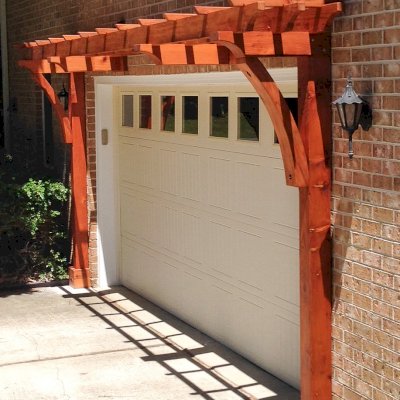 Custom Garage Arbor Kits (Options: 20' x 24", Mature Redwood, 9 ft Posts, Post Anchor Kit for High-Wind, Transparent Premium Sealant). Photo Courtesy of Josef Messmer of Fayetteville, Pennsylvania.