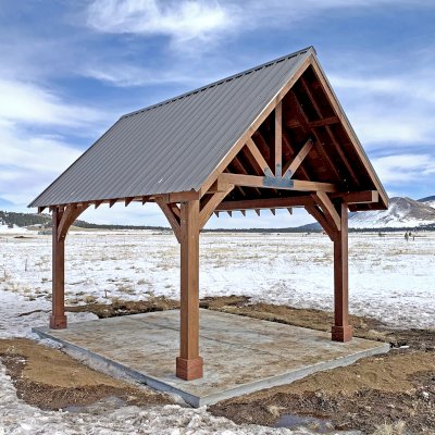 Gothic Pavilion  (Options: 18' L x 14' W, Mature Redwood, 8x8 Posts, 4-Post Anchor Kit for High-Wind, No Electrical Wiring Trims, No Fan Base, Coffee-Stain Premium Sealant). Photo Courtesy of G. Szarameta of Flagstaff, AZ.