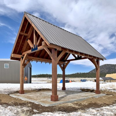 Gothic Pavilion  (Options: 18' L x 14' W, Mature Redwood, 8x8 Posts, 4-Post Anchor Kit for High-Wind, No Electrical Wiring Trims, No Fan Base, Coffee-Stain Premium Sealant). Photo Courtesy of G. Szarameta of Flagstaff, AZ.