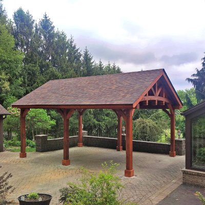Granada Pavilion (Options: 8in x 8in Post Thickness, 24' L x 18' W, No Privacy Panels, Mature Redwood, with Fascia Boards, 9.5 ft Post Height, Electrical Wiring Trim for 2 Posts, No Post Decorative Trim, 6-Post Anchor Kit for High-Wind, No Ceiling Fan Base, No Curtain Rods, Transparent Premium Sealant). Photo Courtesy of A. Czysz of New Tripoli, Pennsylvania.