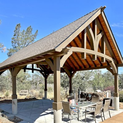 Custom Granada Pavilion (Options: 30’ L x 20’ W, Mosaic Douglas-Fir, Increased Roof Pitch From 7/12 to 10/12 by Custom Request, Post Anchor Kit for High Wind, No Electrical Wiring Trim Kit, 2 Ceiling Fan Bases, Custom Finish [Transparent Premium Sealant for Roof Boards]), Photo Courtesy of K. Kremer of Chico, CA.