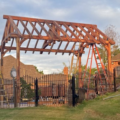 Custom Granada Pavilion Under Construction (Options: 20 ft x 15 ft, Mosaic Redwood, 4-Post Anchor Kit for High-Wind, No Fascia Board, No Curtain Rods, 3 Ceiling Fan Bases, Transparent Premium Sealant). Shake from DaVinci Roof [https://www.davinciroofscapes.com/]. Photo Courtesy of K. Lowe of Newcastle, Oklahoma.