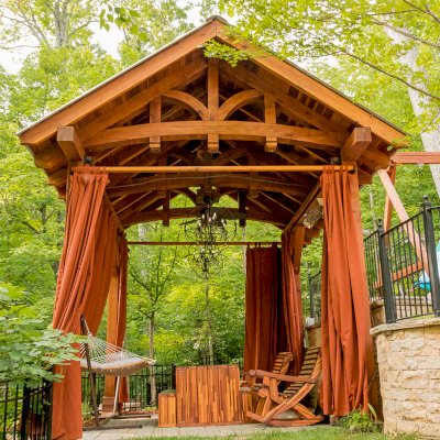 Granada Pavilion (Options: 6in x 6in post thickness, 18' L x 15' W, No Privacy Panels, California Redwood, No Fascia Board for Gutters, 10.5ft Post Height, 1 Electrical Wiring Trim, No Post Decorative Trim, 4-Post Anchor Kit for High-Wind, 3 Ceiling Fan Bases (CUSTOM REQUEST), 4 Heavy Duty Curtain Rods & Stainless Steel Hangars, Transparent Premium Sealant). Photo Courtesy of J. Rynerson of Franklin, Tennessee.