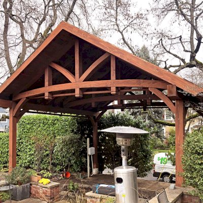 Granada Pavilion (Options: 8in x 8in post thickness, 21' L x 24'-7" W, No Privacy Panels, California Redwood, No Fascia Board for Gutters, 10 ft Post Height, 1 Electrical Wiring Trim, No Post Decorative Trim, 4-Post Anchor Kit for High-Wind, 1 Ceiling Fan Base, 4 Curtain Rods, Coffee-Stain Premium Sealant). Photo Courtesy of T. Hatfield of Portland, Oregon.