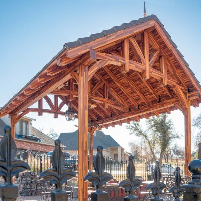 Custom Granada Pavilion (Options: 20 ft x 15 ft, Mosaic Redwood, 4-Post Anchor Kit for High-Wind, No Fascia Board, No Curtain Rods, 3 Ceiling Fan Bases, Transparent Premium Sealant). Shake from DaVinci Roof [https://www.davinciroofscapes.com/]. Photo Courtesy of K. Lowe of Newcastle, Oklahoma.