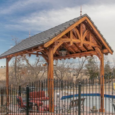 Custom Granada Pavilion (Options: 20 ft x 15 ft, Mosaic Redwood, 4-Post Anchor Kit for High-Wind, No Fascia Board, No Curtain Rods, 3 Ceiling Fan Bases, Transparent Premium Sealant). Shake from DaVinci Roof [https://www.davinciroofscapes.com/]. Photo Courtesy of K. Lowe of Newcastle, Oklahoma.