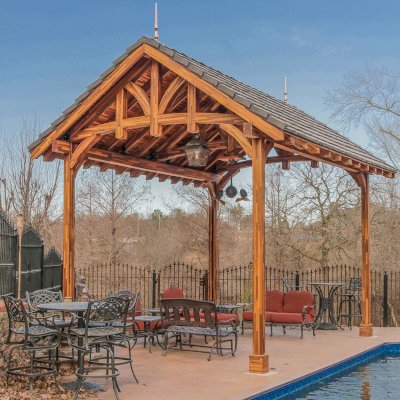 Custom Granada Pavilion (Options: 20 ft x 15 ft, Mosaic Redwood, 4-Post Anchor Kit for High-Wind, No Fascia Board, No Curtain Rods, 3 Ceiling Fan Bases, Transparent Premium Sealant). Shake from DaVinci Roof [https://www.davinciroofscapes.com/]. Photo Courtesy of K. Lowe of Newcastle, Oklahoma.