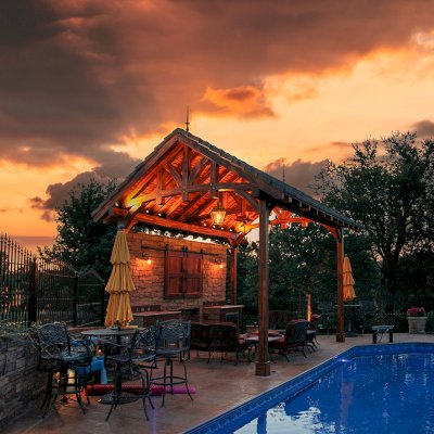 Custom Granada Pavilion (Options: 20 ft x 15 ft, Mosaic Redwood, 4-Post Anchor Kit for High-Wind, No Fascia Board, No Curtain Rods, 3 Ceiling Fan Bases, Transparent Premium Sealant). Shake from DaVinci Roof [https://www.davinciroofscapes.com/]. Photo Courtesy of K. Lowe of Newcastle, Oklahoma.