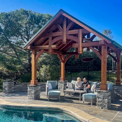 Custom Granada Pavilion (Options: 12’ L x 16’ W, California Redwood, 4-Post Anchor Kit for High Wind, Electrical Wiring Trim Kit for 1 Post, 1 Ceiling Fan Base, Transparent Premium Sealant), Photo Courtesy of S. Moore of Shingle Springs, California.