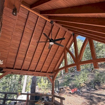 Custom Attached Granada Pavilion (Options: 10’ L x 18’ W, Mosaic Redwood, Increased Roof Pitch by Custom Request, Post Anchor Kit for High Wind, No Electrical Wiring Trim Kit, No Ceiling Fan Base, Coffee-Stain Premium Sealant).