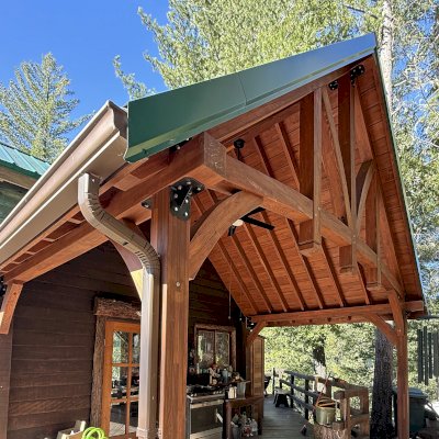Custom Attached Granada Pavilion (Options: 10’ L x 18’ W, Mosaic Redwood, Increased Roof Pitch by Custom Request, Post Anchor Kit for High Wind, No Electrical Wiring Trim Kit, No Ceiling Fan Base, Coffee-Stain Premium Sealant).