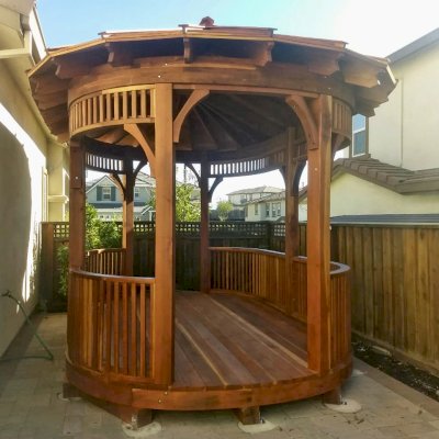 Custom Hexagonal Retreat Pavilion (Options: 15' L x 10'-6" W, Oval Shape Instead of Hexagonal by Custom Request, with Deck, California Redwood, With Upper Corvels and Lower Panels, Transparent Premium Sealant). Photo Courtesy of A. Singh of Dublin, California.