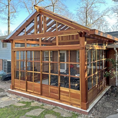 Custom Illuminati Pavilion (Options: 13’-4’’ L x 18’-6’’ W, California Redwood, Enclosed by Custom Request, 11’ Post Height, Standard Post Anchor Kit, 1 Ceiling Fan base, Wooden Cover for Gutter, Transparent Premium Sealant). Photo Courtesy of P. Morris of Seven Corners, VA.