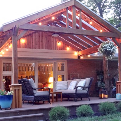 Illuminati Porch Pavilion (Options: 11'-6" L, 17' W, California Redwood, No Electrical Wiring Trim, 2-Post Anchor Kit for High-Wind, 1 Ceiling Fan Base, No Privacy Panels, No Curtain Rods, 9' Post Height, with Custom Boxes at the Bottom of the Posts, Transparent Premium Sealant). Customer requested transparent polycarbonate panels for roof. Yes, we can custom make your pavilion with any custom detail you like... Courtesy of Andy Goodrich of Mt. Prospect, IL.