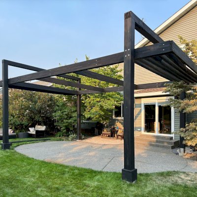 Custom L.A. Modern Pergola (Options: 26' L x 15' W, Mosaic Redwood, without Rain Guard, 12 ft Post Height, No Electrical Wiring Trim, Post Anchor Kit for High-Wind, No Ceiling Fan Base, No Retractable Shade Canopy, Black Stain Premium Sealant). Photo Courtesy of B. James of Liberty Lake, WA.