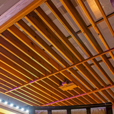 L.A. Modern Pergola (Options: 16' L, 12' W, California Redwood, with Rain Guard, 10 ft Post Height, 2 Electrical Wiring Trims, 4-Post Anchor Kit for Concrete, 1 Ceiling Fan Base, No Retractable Shade Canopy, Transparent Premium Sealant). Photo Taken 1 Year After Installation. Photo Courtesy of T. Huber of Round Rock, TX.