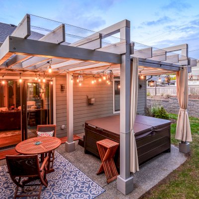 Custom L.A. Modern Pergola (Options: 17' L, 12' W, Douglas-fir, 10.5 ft Post Height, No Electrical Wiring Trim Kit, 4-Post Anchor Kit for Concrete, No Ceiling Fan Base,  with Transparent Rain Guard, Custom Paint Finish) with 1 Standalone Privacy Panel (Louvered). Photo Courtesy of J. Williamson of Bow, Washington.