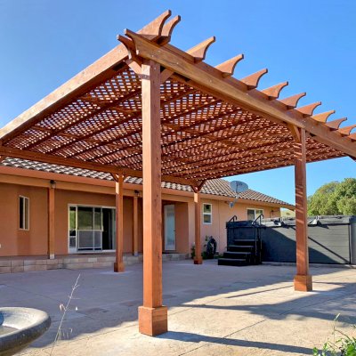 Lattice Pergola Kit (Options: 24' L x 20' W, California Redwood, No Electrical Wiring Trim, Lengthwise Roof Support Timbers, 6-Post Anchor Kit for Concrete, No ceiling Fan Base, No Privacy Panels, No Curtains Rods, 9.5' Post Height, Transparent Premium Sealant). Photo Courtesy of C. Lopez of Salinas, CA.