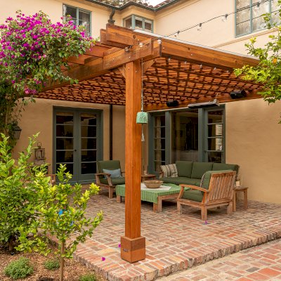 Custom Lattice Pergola Kit (Options: 19' L x 16' W, California Redwood, Electrical Wiring Trim for 2 Posts, 4-Post Kit for Concrete, No Ceiling Fan Base, No Privacy Panels, No Curtain Rods, 9' Post Height, Transparent Premium Sealant). Lattice panels were customized with larger openings than is the standard design. Photo Courtesy of D. Wood of Palo Alto, California.